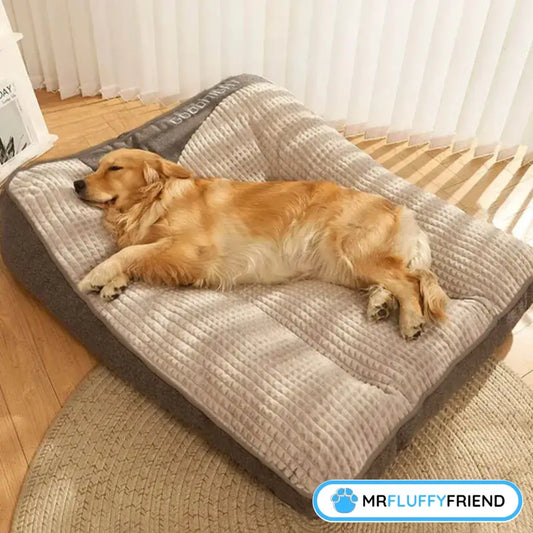 A golden retriever snoozing on a plush calming dog cushion in a cosy indoor spot with soft lighting