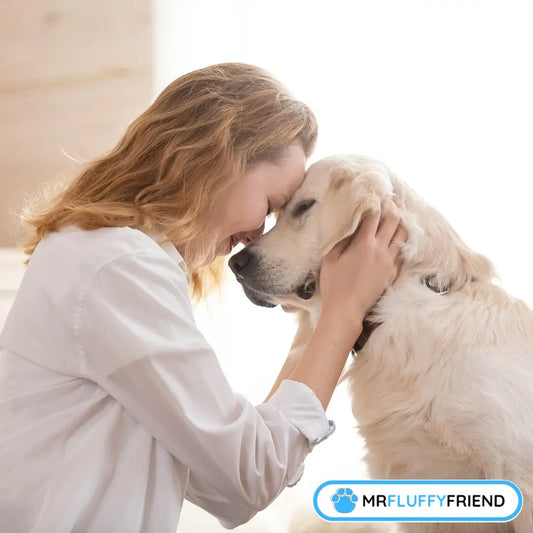 A woman gently touches foreheads with a golden retriever, both with eyes closed, conveying a deep bond and tranquility.